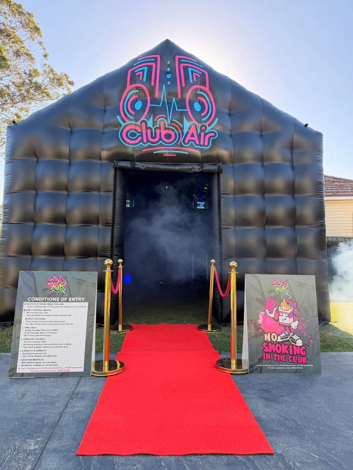 Club Air inflatable nightclub with red carpet entrance and gold bollards in a Sydney backyard